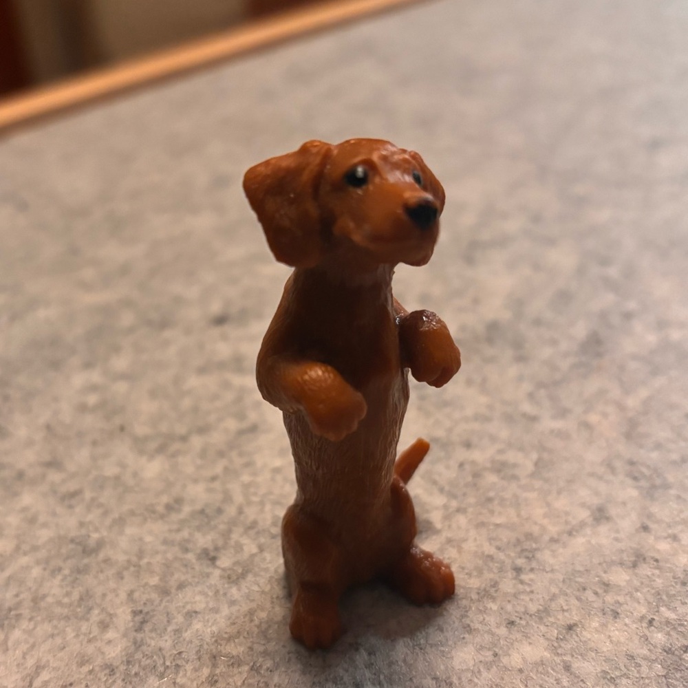 Plastic Dog Figurine Toy - charming, house trained and does not bite.